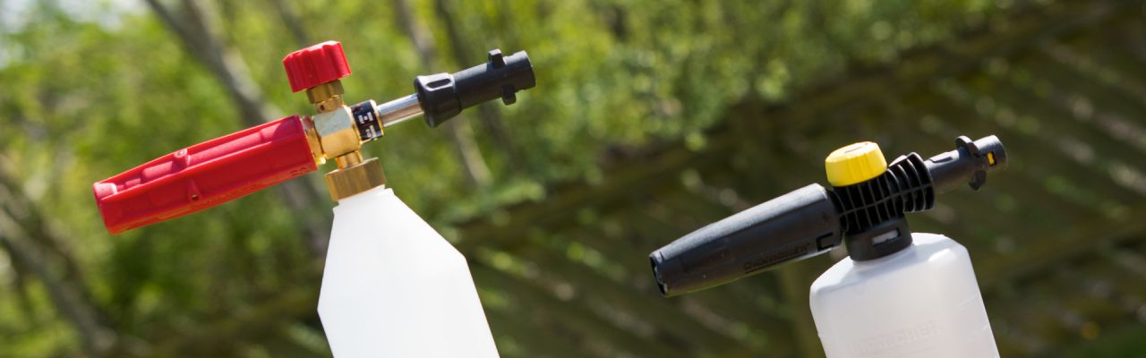 A side on shot of an autobrite lance with its brass hardware and the karcher on the right with its plastic hardware